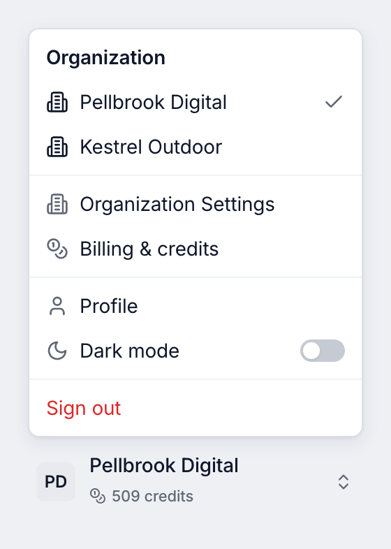 Organization menu with Pellbrook Digital checked, Kestrel Outdoor, Organization Settings, Billing & credits, Profile, a Dark mode switch and Sign out, open above the sidebar button that shows Pellbrook Digital and its credit balance.